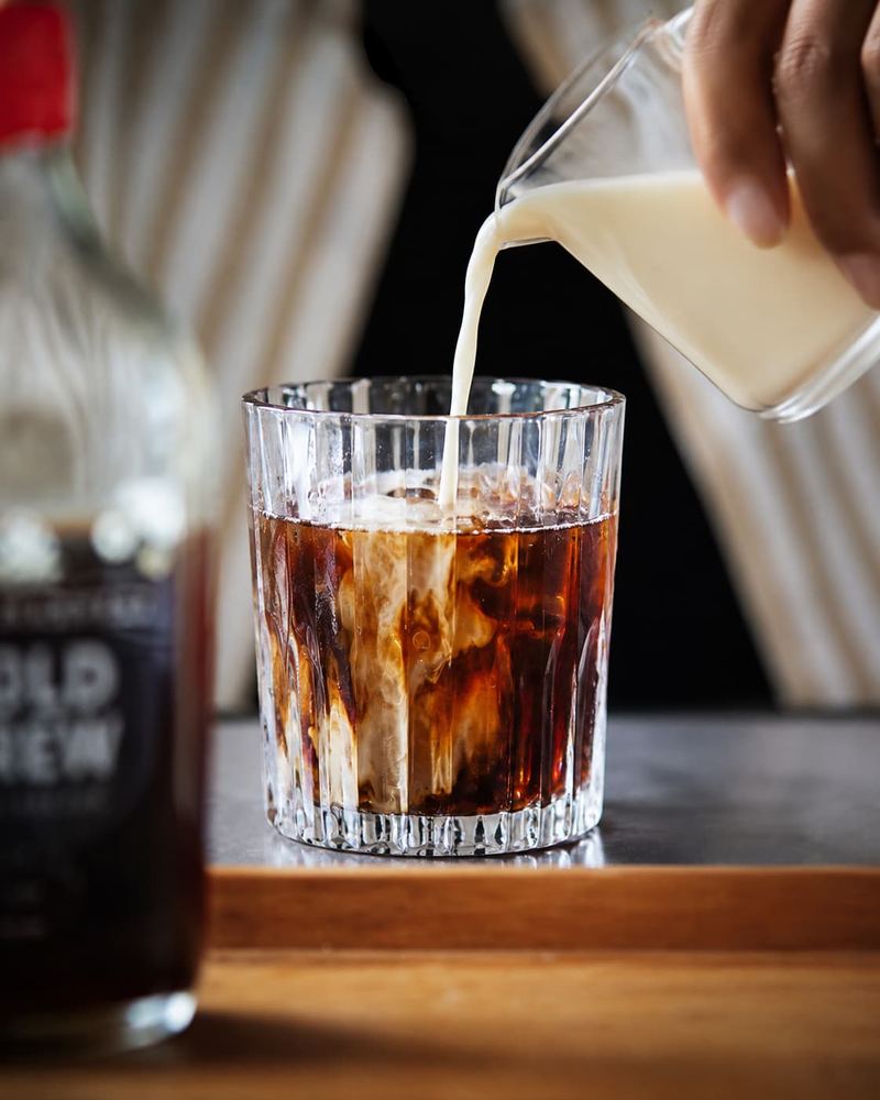 Milk poured over Kāffi cold brew coffee on ice, Colombo 03