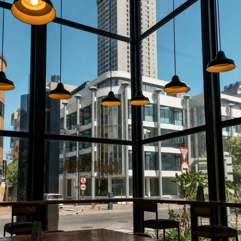 Central Colombo seen through the tall windows of Kāffi Colombo