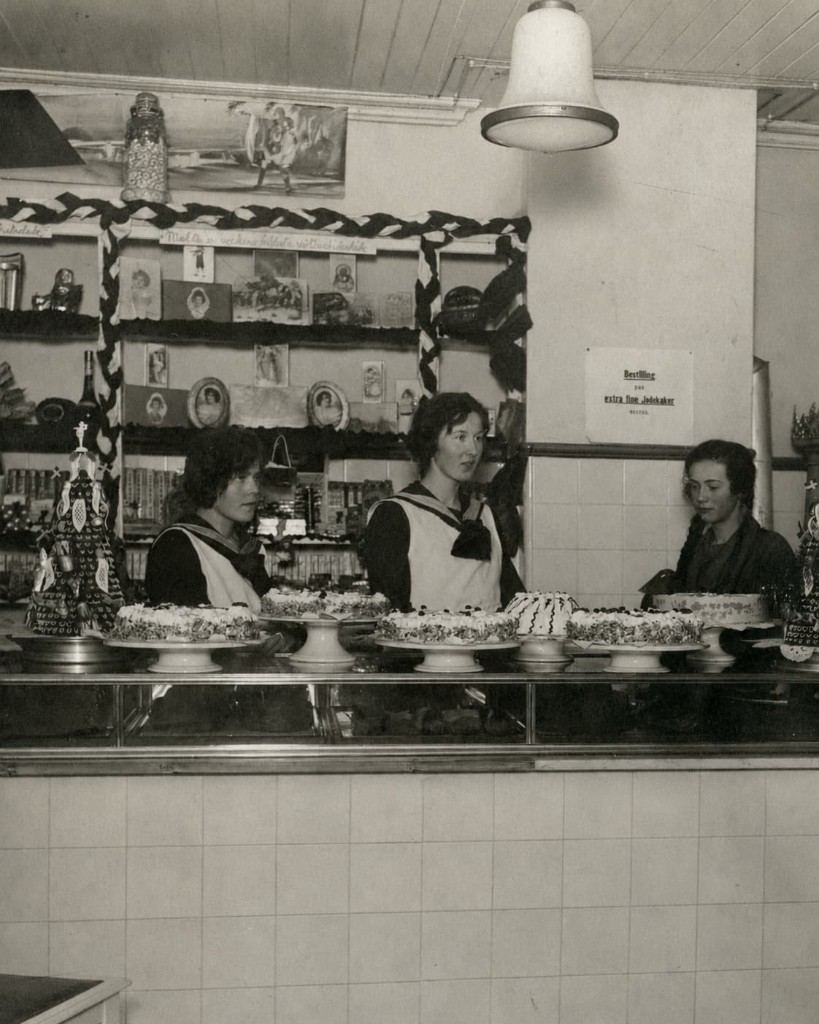 Black-and-white family photograph inside the original bakery in Svelvik, Norway