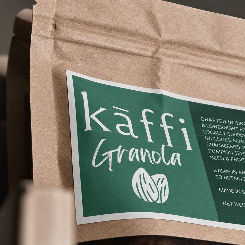 Kāffi granola in a kraft pouch with a green label, made in Sri Lanka
